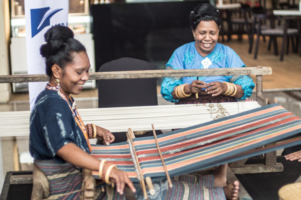 Women in Ikat Sikka Weaving process